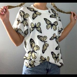 White tshirt with yellow/tan butterfly